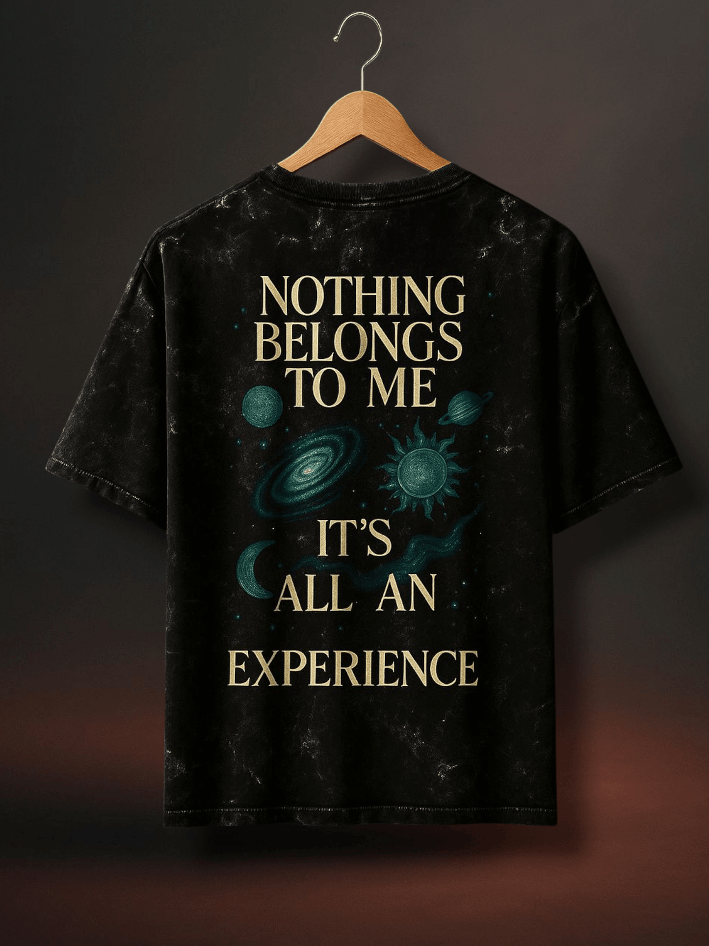 Black acid wash oversized t-shirt featuring cosmic design and inspiring quote about experience.