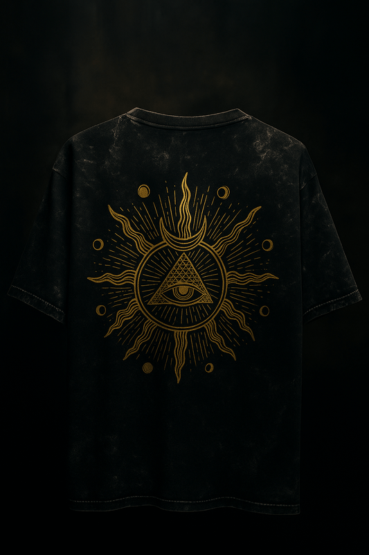 Black acid wash oversized t-shirt featuring a radiant eye and cosmic design on the back.